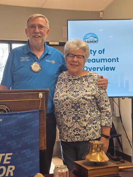 President Doug Emery presenting Yami Goldberg with her Paul Harris Fellow recognition