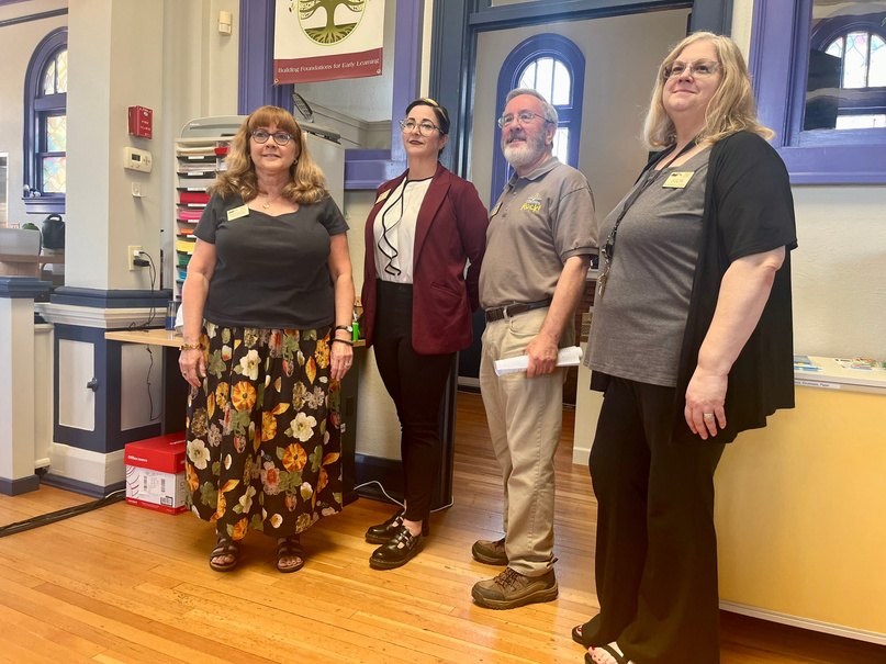Beaumont Library staff giving Rotarians a tour of the renovated reading room